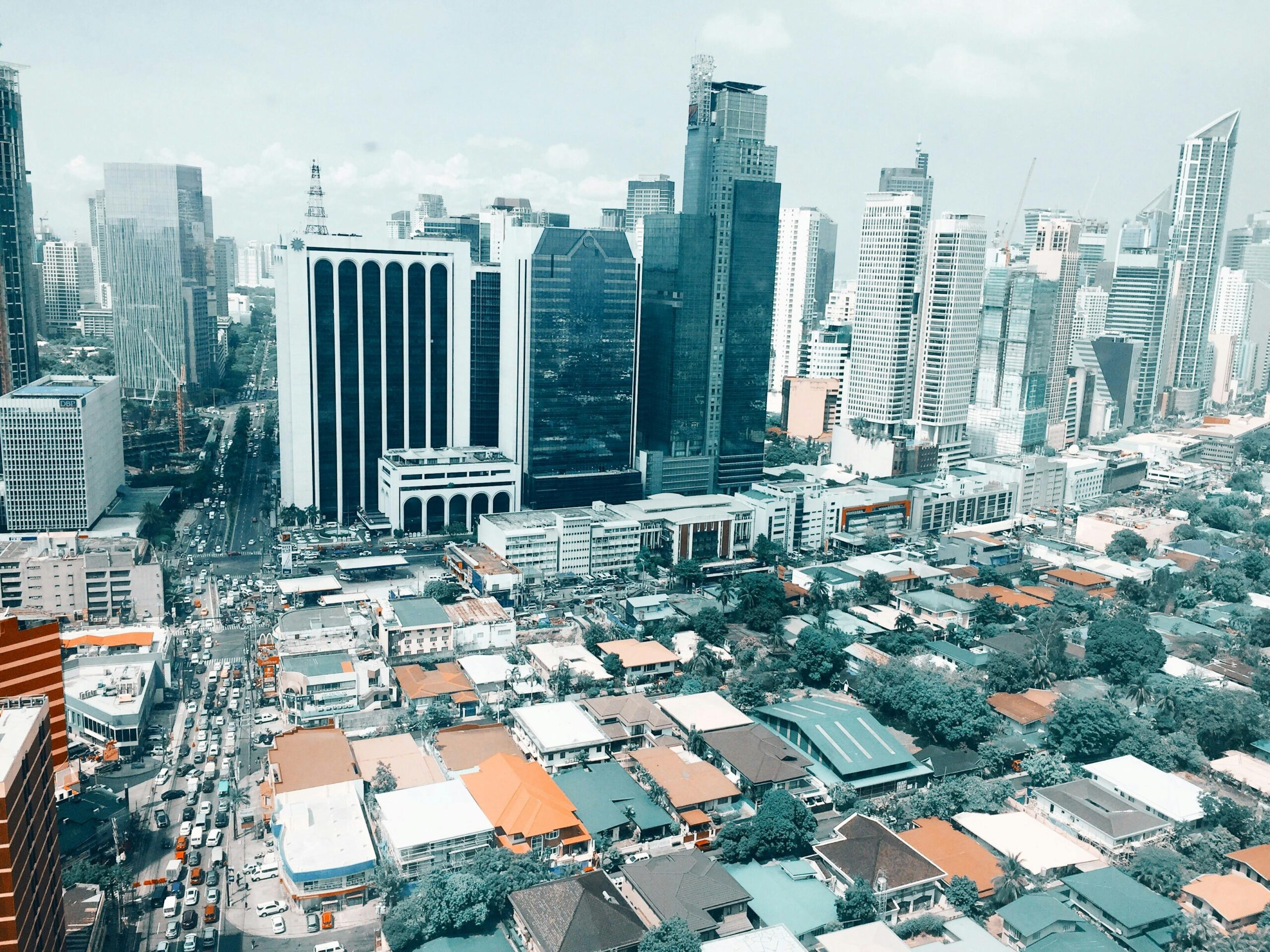 Vibrant aerial photo of the bustling Makati City skyline in the Philippines.